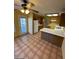 Kitchen with breakfast nook, wood cabinets, and tile floors at 2802 Camelback Ln, Henderson, NV 89074