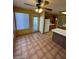 Bright kitchen with wood cabinets, tiled floor, and island at 2802 Camelback Ln, Henderson, NV 89074