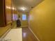 Laundry room with wood flooring, cabinets, and water heater at 2802 Camelback Ln, Henderson, NV 89074