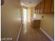 Bright laundry room with built-in cabinets and vinyl flooring at 2802 Camelback Ln, Henderson, NV 89074