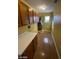 Laundry room with wood cabinets and vinyl flooring at 2802 Camelback Ln, Henderson, NV 89074