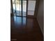 Living area with hardwood floors and sliding doors to patio at 2802 Camelback Ln, Henderson, NV 89074