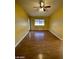 Bright living room features hardwood floors and ceiling fan at 2802 Camelback Ln, Henderson, NV 89074