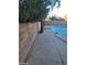 Swimming pool area with diving board and surrounding landscaping at 2802 Camelback Ln, Henderson, NV 89074