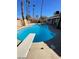 Refreshing blue pool with diving board in backyard at 2802 Camelback Ln, Henderson, NV 89074