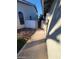 Sidewalk between houses leading to backyard at 2802 Camelback Ln, Henderson, NV 89074