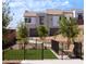 Enclosed dog park with artificial turf, seating, and lush landscaping for pet-friendly recreation at 681 Echelon St, Las Vegas, NV 89138