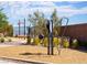 Well-equipped outdoor fitness area with diverse exercise machines and a wood chip surface at 681 Echelon St, Las Vegas, NV 89138