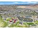 Aerial view of a residential neighborhood featuring a park, pool, and green spaces at 12295 Skyracer Dr, Las Vegas, NV 89138