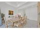 Formal dining room with a large table and stunning artwork at 12295 Skyracer Dr, Las Vegas, NV 89138