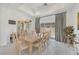 Traditional dining room with large table, matching chairs, classic hutch and marble flooring at 12295 Skyracer Dr, Las Vegas, NV 89138