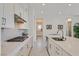 Bright kitchen featuring white cabinets and marble flooring at 12295 Skyracer Dr, Las Vegas, NV 89138