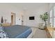 Bright main bedroom with light gray carpet, shutters, and accent chair at 12295 Skyracer Dr, Las Vegas, NV 89138