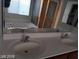 Bathroom featuring a double sink vanity and a luxurious soaking tub for relaxation and comfort at 4085 Oliver Sagebrush Dr, Las Vegas, NV 89122