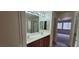 Bathroom featuring double sink vanity, mirror, and shower with glass doors at 4085 Oliver Sagebrush Dr, Las Vegas, NV 89122