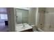 Bright bathroom featuring a vanity, toilet, and shower-tub combination near a window at 4085 Oliver Sagebrush Dr, Las Vegas, NV 89122