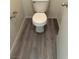 Modern bathroom with wood-look flooring and a toilet at 4085 Oliver Sagebrush Dr, Las Vegas, NV 89122