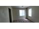 Bedroom featuring two bright windows and a closet; a harmonious blend of comfort and functionality at 4085 Oliver Sagebrush Dr, Las Vegas, NV 89122