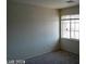 Bright bedroom with neutral walls, carpet, and a window with blinds at 4085 Oliver Sagebrush Dr, Las Vegas, NV 89122