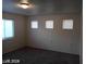 Bedroom with neutral walls, carpet flooring, and natural light streaming through multiple windows at 4085 Oliver Sagebrush Dr, Las Vegas, NV 89122