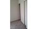 Bedroom with sliding closet doors, carpet and neutral color scheme at 4085 Oliver Sagebrush Dr, Las Vegas, NV 89122
