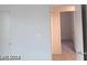Bedroom with neutral color scheme and open doorway to another room at 4085 Oliver Sagebrush Dr, Las Vegas, NV 89122