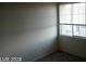 Bright bedroom with neutral walls, carpet, and a window with blinds at 4085 Oliver Sagebrush Dr, Las Vegas, NV 89122