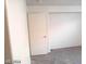 Bedroom featuring carpet, and a door; neutral color palette providing a blank canvas for personalization at 4085 Oliver Sagebrush Dr, Las Vegas, NV 89122