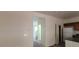 Bright entryway with doorway leading to stairs and kitchen featuring a white refrigerator at 4085 Oliver Sagebrush Dr, Las Vegas, NV 89122