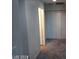 Bright hallway with neutral paint, and carpet leading to bedrooms, bathroom, and utility room at 4085 Oliver Sagebrush Dr, Las Vegas, NV 89122