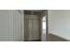 This hallway has neutral walls and trim and a closet with folding doors at 4085 Oliver Sagebrush Dr, Las Vegas, NV 89122