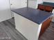 Spacious kitchen island with dark countertop and white base with storage at 4085 Oliver Sagebrush Dr, Las Vegas, NV 89122