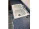 A clean, double basin kitchen sink featuring a modern faucet and a dark countertop at 4085 Oliver Sagebrush Dr, Las Vegas, NV 89122