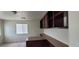 Office space with upper cabinets, desk space, and natural light from a window at 4085 Oliver Sagebrush Dr, Las Vegas, NV 89122