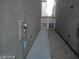 This side yard has gravel and a cement walkway to a white gate at 4085 Oliver Sagebrush Dr, Las Vegas, NV 89122