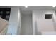 Bright upstairs hallway with white walls, featuring an interior door and wall decor at 4085 Oliver Sagebrush Dr, Las Vegas, NV 89122