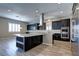 Modern kitchen with granite counters and stainless steel appliances at 1140 Apollo Gardens St, Henderson, NV 89052