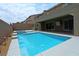 Inviting backyard oasis featuring a refreshing pool and spa at 1140 Apollo Gardens St, Henderson, NV 89052