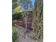 View of a backyard with plants, decorative gravel landscaping, and partial fencing around the perimeter at 2881 Thunder Bay Ave, Henderson, NV 89052