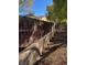View of a backyard with a newly installed brown fence and desert landscaping at 2881 Thunder Bay Ave, Henderson, NV 89052