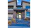 Modern home with a glass front door and stone accents at 10632 Patina Hills Ct, Las Vegas, NV 89135