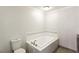 Bright bathroom featuring a bathtub and toilet at 3933 Edgemoor Way, Las Vegas, NV 89121