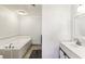 Bathroom with white cabinets, and a bathtub at 3933 Edgemoor Way, Las Vegas, NV 89121