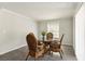 Bright dining room with wicker chairs and a glass table at 3933 Edgemoor Way, Las Vegas, NV 89121