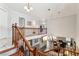 Bright living room showcasing a fireplace and lots of natural light, open to an upstairs loft area at 3933 Edgemoor Way, Las Vegas, NV 89121