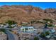 Property is nestled in the mountains with a stunning view at 7090 Fazio Dr, Las Vegas, NV 89110