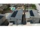 Aerial view of modern houses with solar panels and a partially completed backyard at 6503 Adrian Ridge Ct, Las Vegas, NV 89149