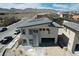 View of a new construction home, featuring a modern design with a two-car garage in an active construction zone at 6527 Adrian Ridge Ct, Las Vegas, NV 89149