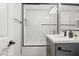 Bathroom with a tiled tub/shower combo, vanity, framed mirror, and black hardware at 3784 Pama Ln, Las Vegas, NV 89120
