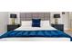 King-size bed with gray headboard, navy blue bedding, and side tables at 3784 Pama Ln, Las Vegas, NV 89120